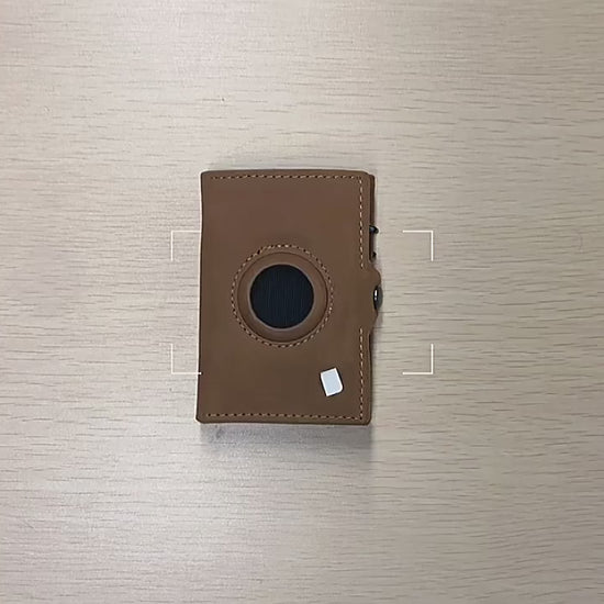 Billetera de cuero con AirTag y bloqueo RFID, diseño elegante y funcional para máxima seguridad. Ideal para ejecutivos y viajeros que buscan estilo, tecnología y protección en un solo accesorio.